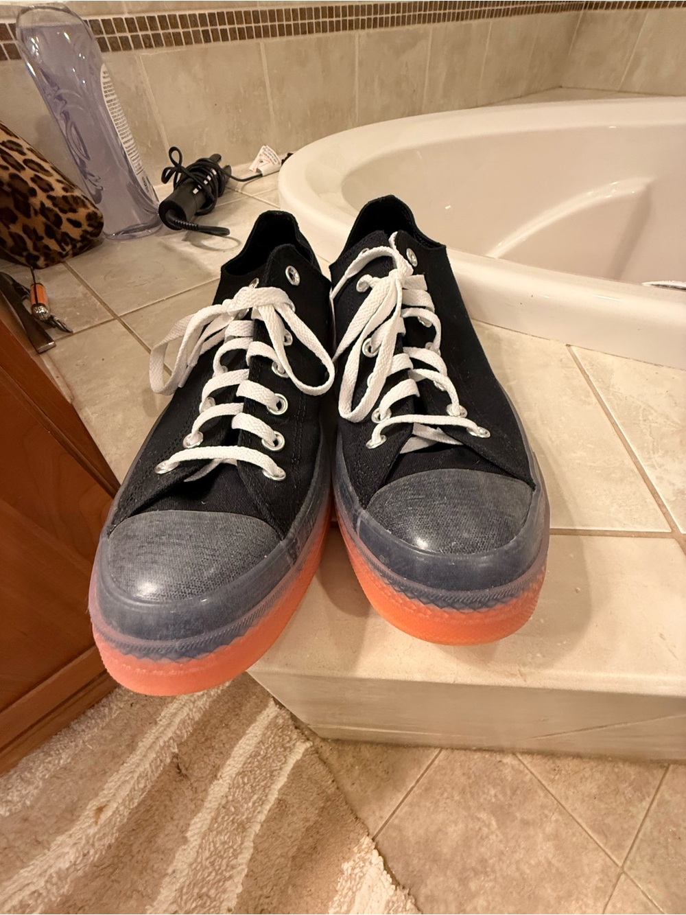 Rare Converse Black Canvas Low-Top Sneakers with Orange Sole and Clear Wrap.